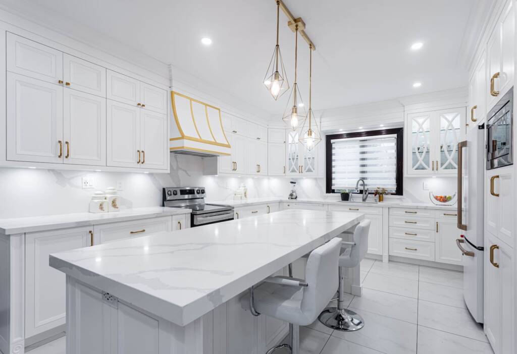 modern white kitchen with marble island and countertops - white custom kitchen cabinetry