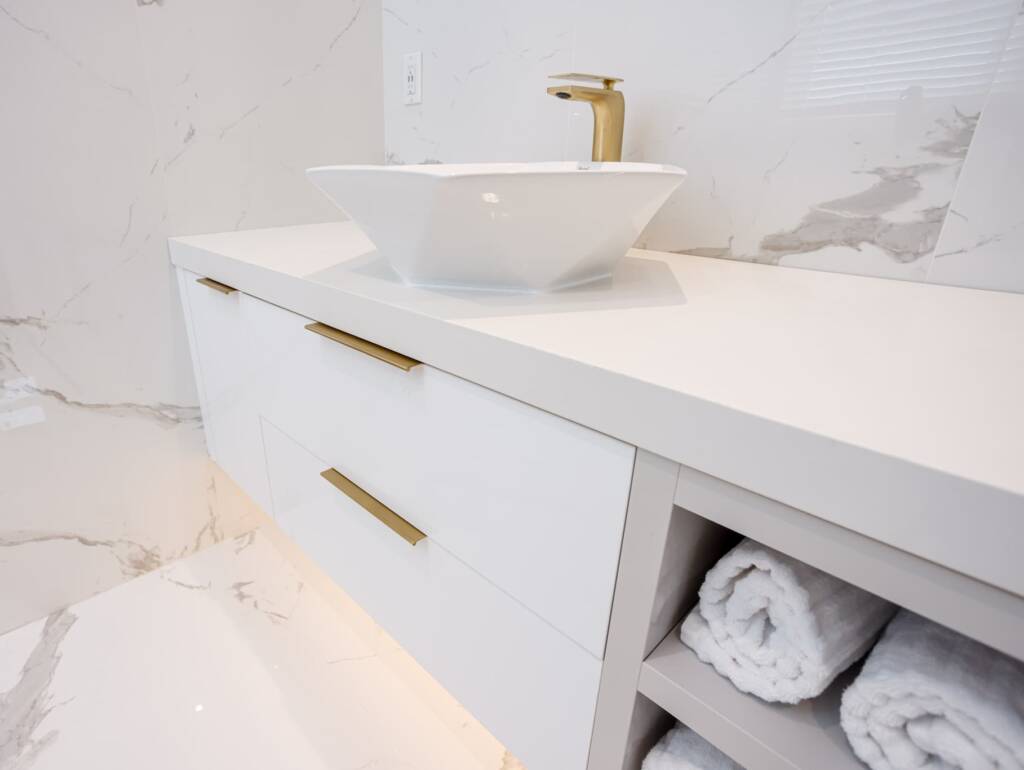 golden line faucet with marble design wall for bathroom in richmond hill