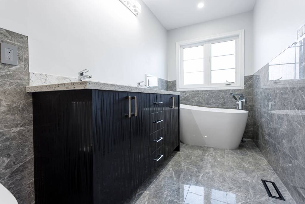 Custom-wood-vanity-with-freestanding-thub