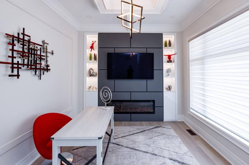 modern tv unit with custom fire place and lightened shelves